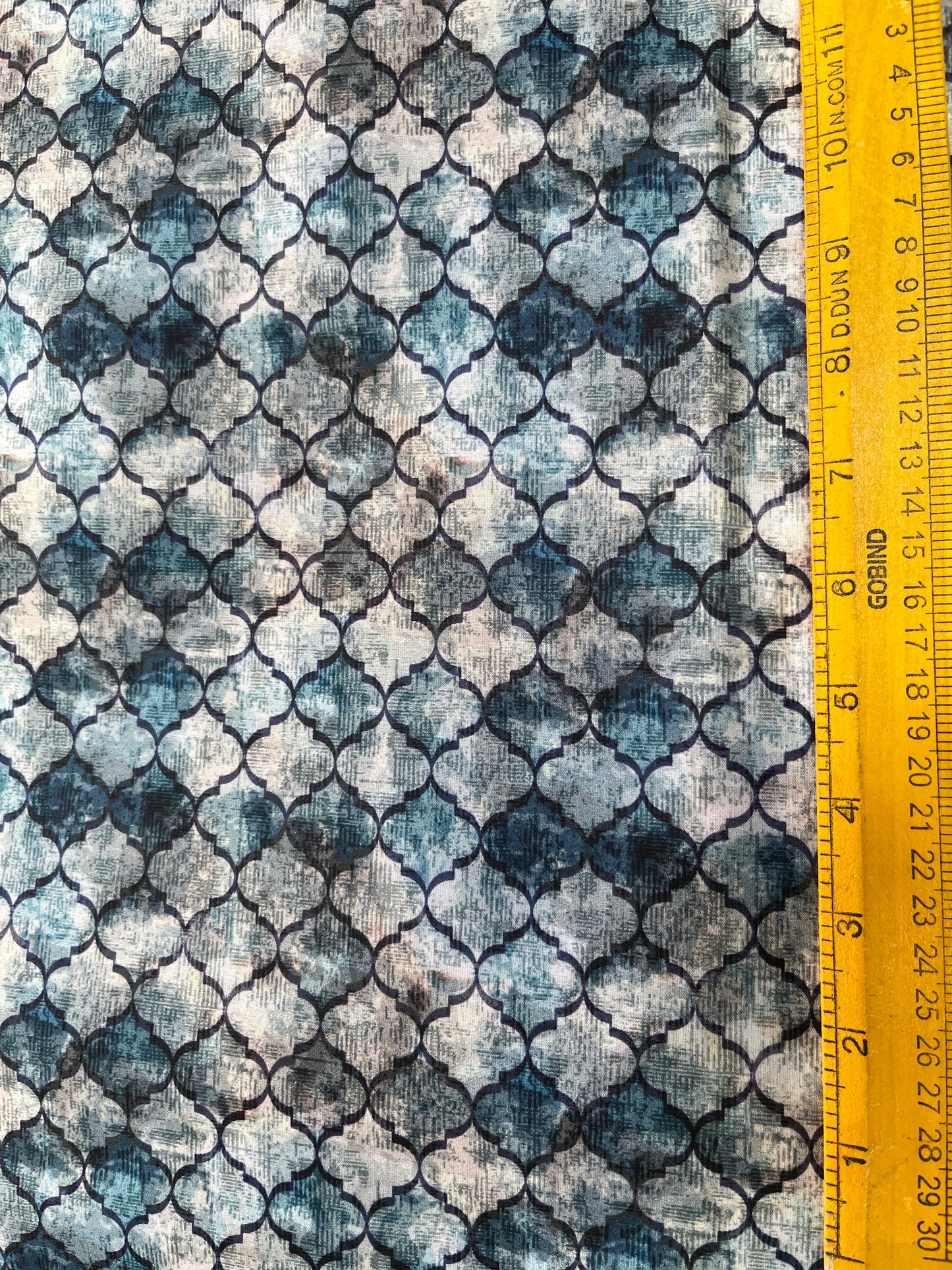 Patterned fabric with a ruler at the top for scale