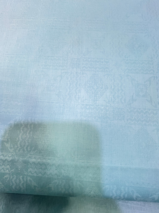 Close-up of textured light blue fabric addi.