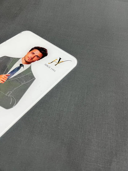 Gray fabric with a label featuring a person in a suit and a logo.