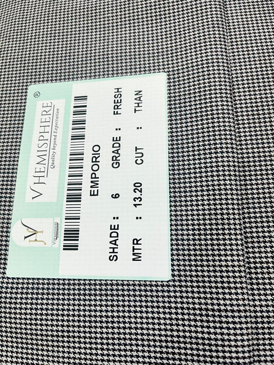 Fabric with a label displaying text and a barcode on a checkered pattern background